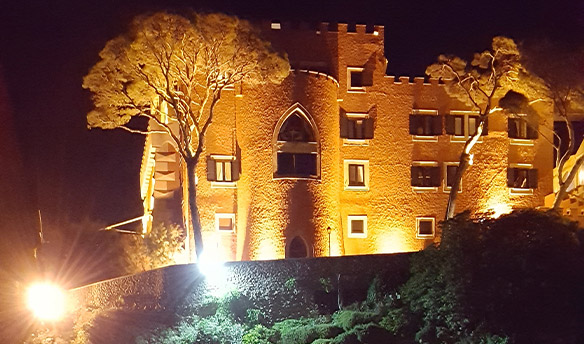 Building lit up by lights in the dark